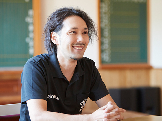 笑顔で話す門田隆稔さん